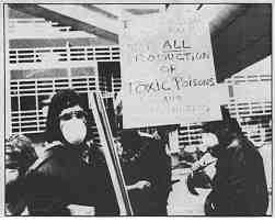 photo: "Industrialism is the Enemy" says the sign above, reflecting an understanding that the Detroit incinerator is not an isolated "mistake." -photo/Rebecca Cook.