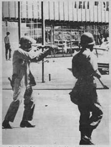 Photo showing 2 National Guardsmen aiming rifles, Berkeley, May 1969.