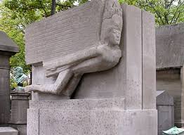 A color photo shows Oscar Wilde's monument in Pere Lachaise Cemetary in Paris.