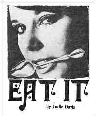 Photo shows close-up of a young woman with a spoon held between her teeth