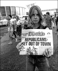 Photo shows a stern-faced young woman holding a copy of Fifth Estate newspaper. The headline reads, "Republicans: get out of town."