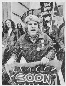 Photo of protest demonstration, Detroit, April 1970. Signs read FREE JOHN NOW.